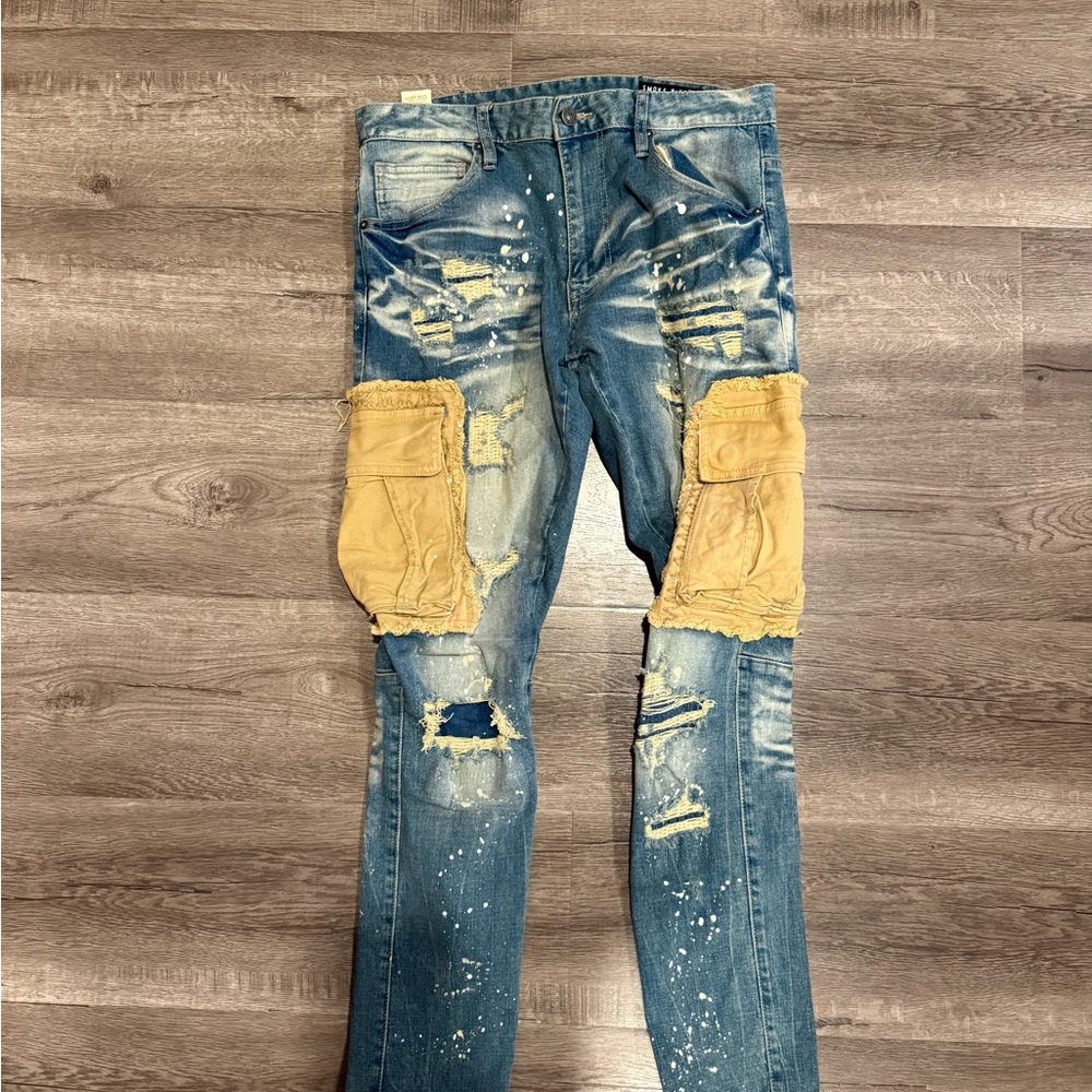 Distressed Blue Jeans with Tan Patches